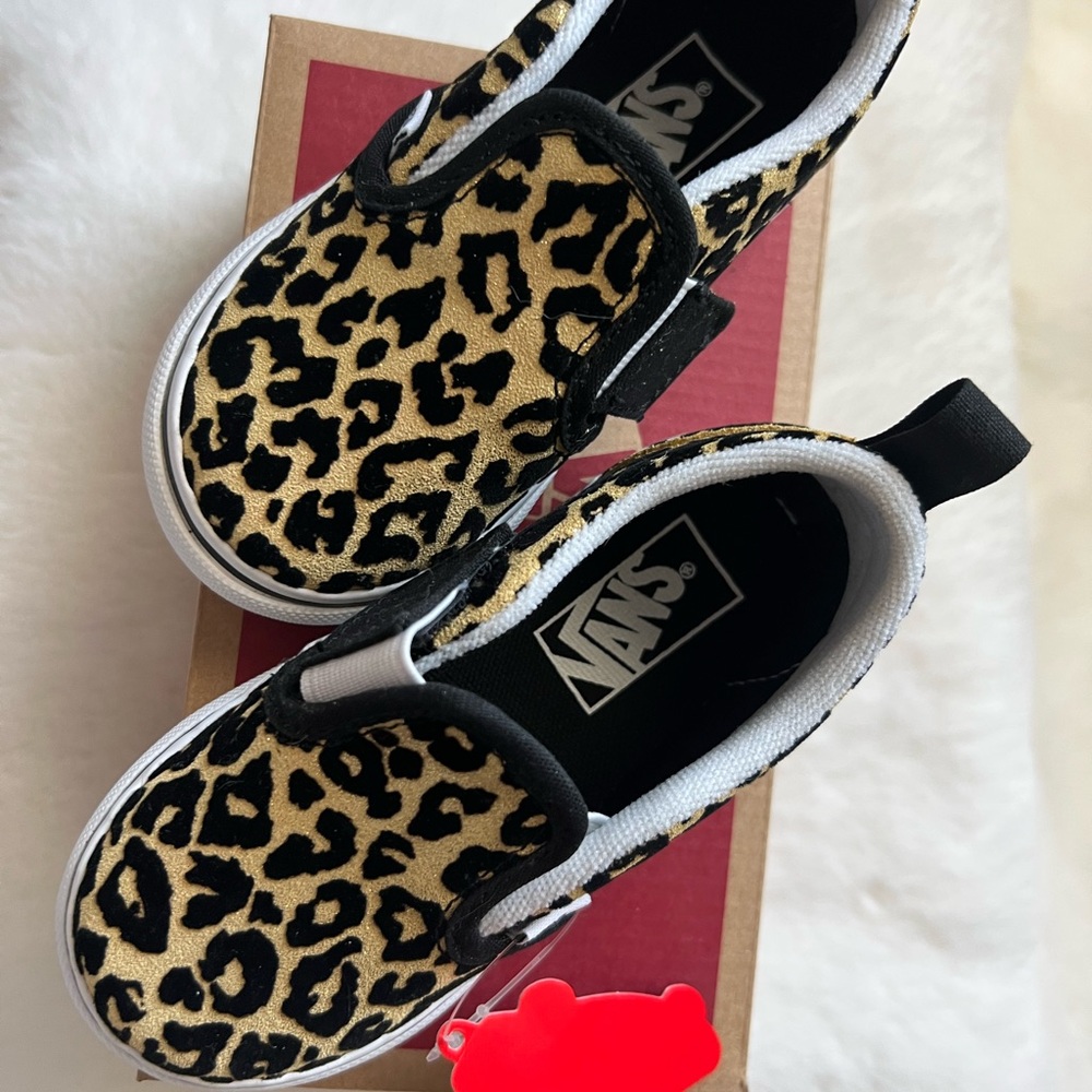 Slip on black and gold cheetah print vans